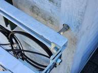 Stainless steel coupling nuts connect the studs to normal bolts.