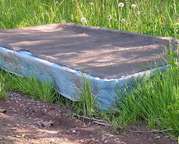 Does this look like a project to you? It does to me. Image: A bed foundation on side of road.