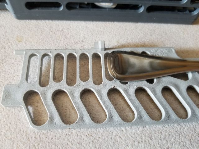 Image: The flatware does not fit into the dishwashter rack.