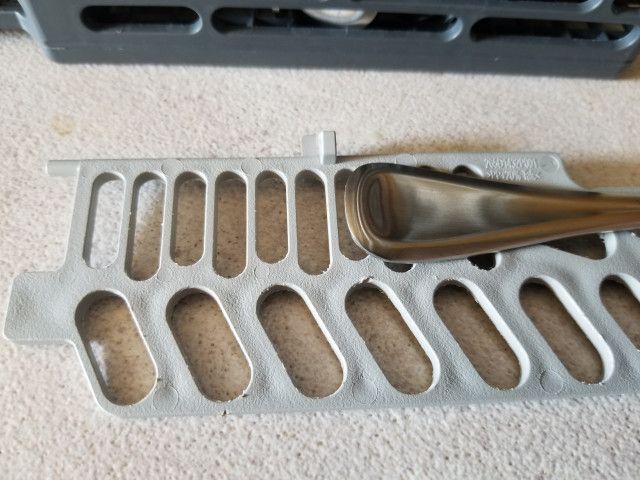 This is not good. Image: The flatware does not fit into the dishwashter rack.