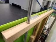 A 3/4" hole keeps the 1/2" EMT managed. The angle brackets are held in a groove in the sheet metal of the tool chest.