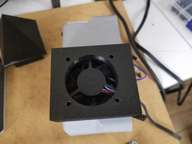 The induction fan is mounted in its holder.