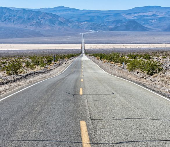 Image: A long straight road.