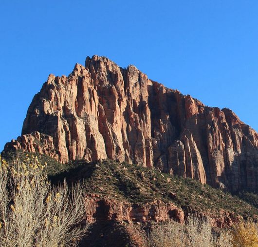Time and Nature wear down even the most resilient. Image: Jagged desert mesa.
