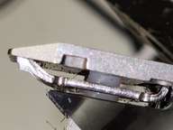 There is a slot the same size as the plastic part, but the plastic part isn't in the slot.