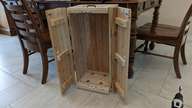 The base holds the chest up off the floor so the doors open easily.