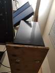 1/16" aircraft cable holds these plywood shelves up. It is actually a great system. Very strong and stable.