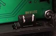 Just a touch here and there with a hot soldering iron tip, and the holder is welded in place.